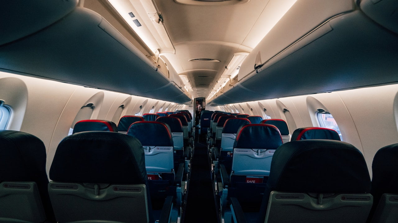 Empty seats in passenger cabin of commercial airplane. Flying and travelling concepts.
